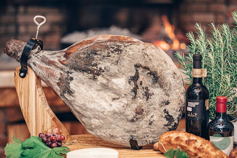 Unique Taste of Prosciutto: Cut Straight from its Stand