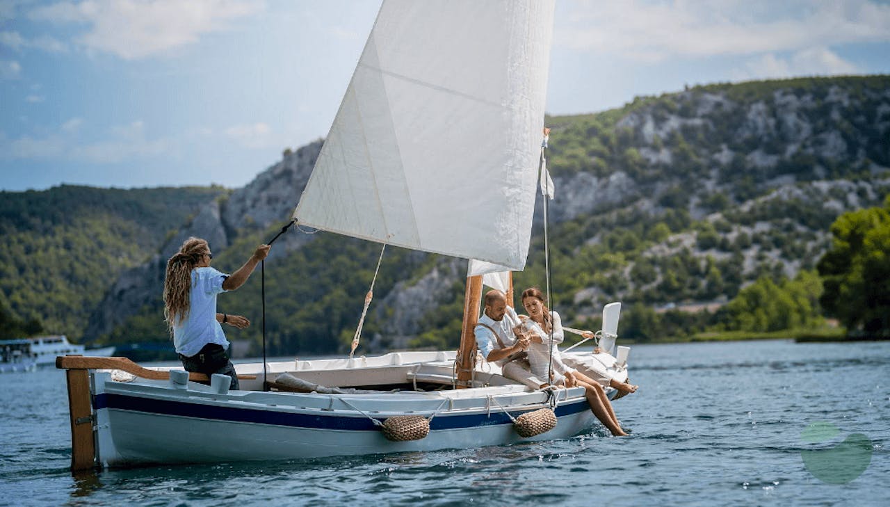 Sail Along the Krka River with a Glass of Wine at Hand